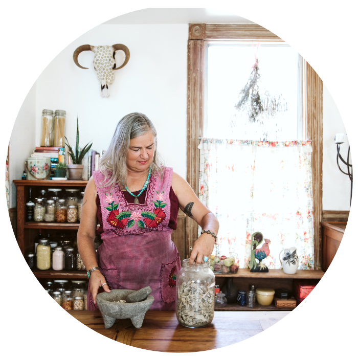 Ratka Popovic using pestle and herbs